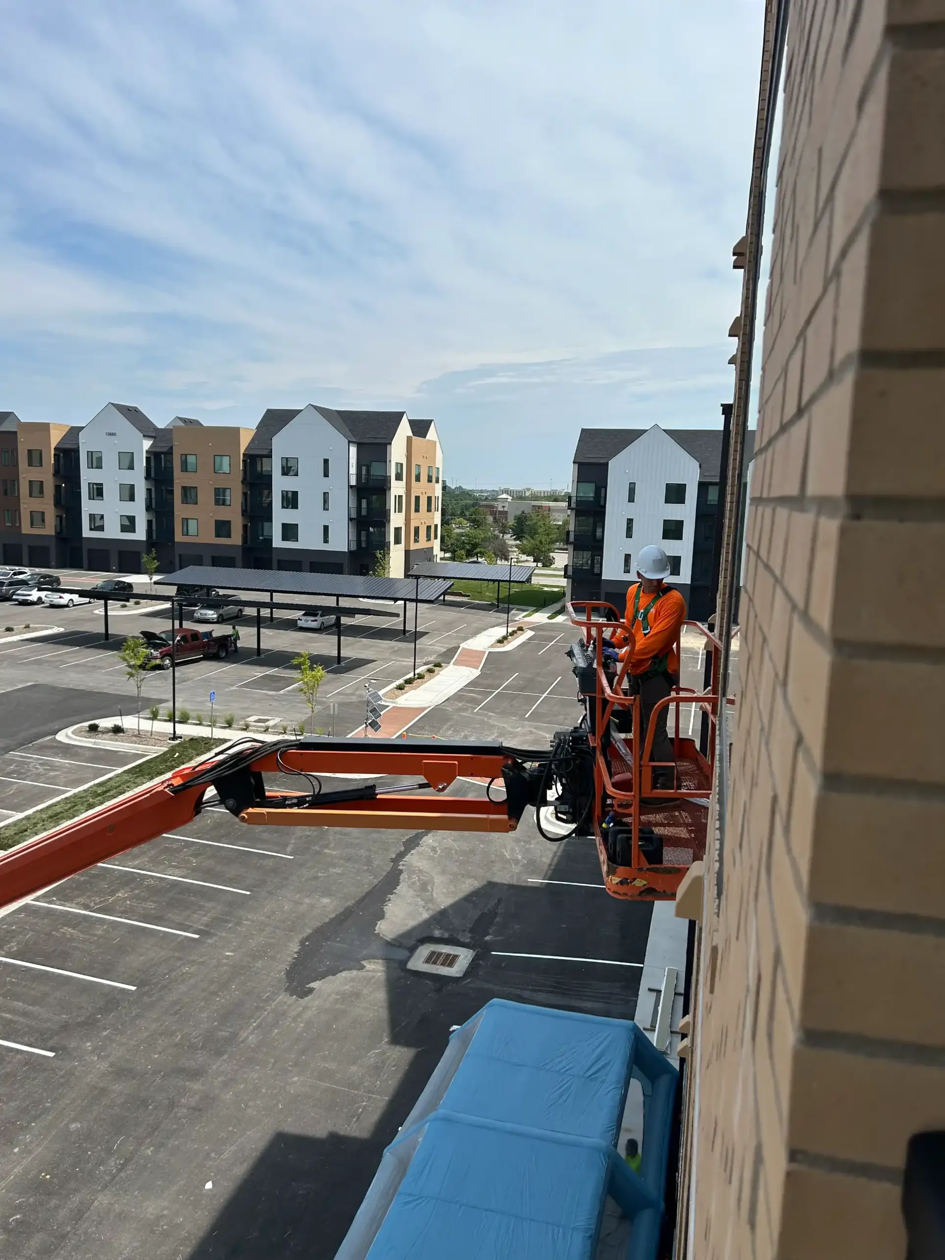 Professional window repair on building exterior